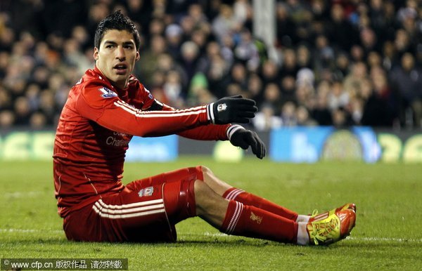 Liverpool's Luis Suarez sits on the pitch during the English Premier League soccer match between Fulham and Liverpool at Craven Cottage, south London, Britain, 05 December 2011.