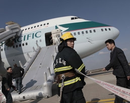 Cathay Pacific flight evacuated in fire scare.[Photo/Shanghai Daily]