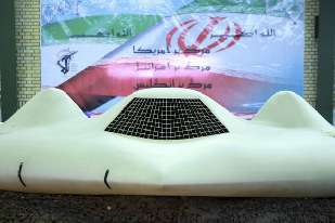 US drone shot down by Iran unveiled on TV