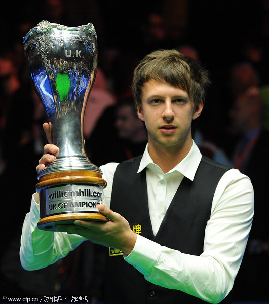  England's Judd Trump celebrates with the trophy after winning the williamhill.com UK Championships at the Barbican Centre, York.