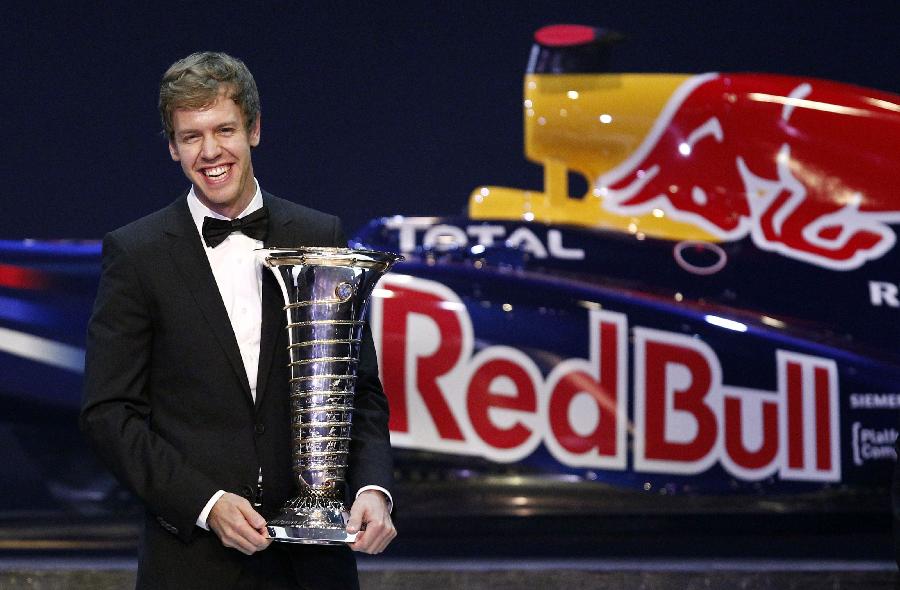 Sebastian Vettel holds a trophy awarded at the annual FIA prize-giving gala in Delhi, Dec. 9, 2011. Vettel collected the trophy for a second straight year at the FIA Prize Giving Gala in New Delhi. (Xinhua/Reuters Photo) 