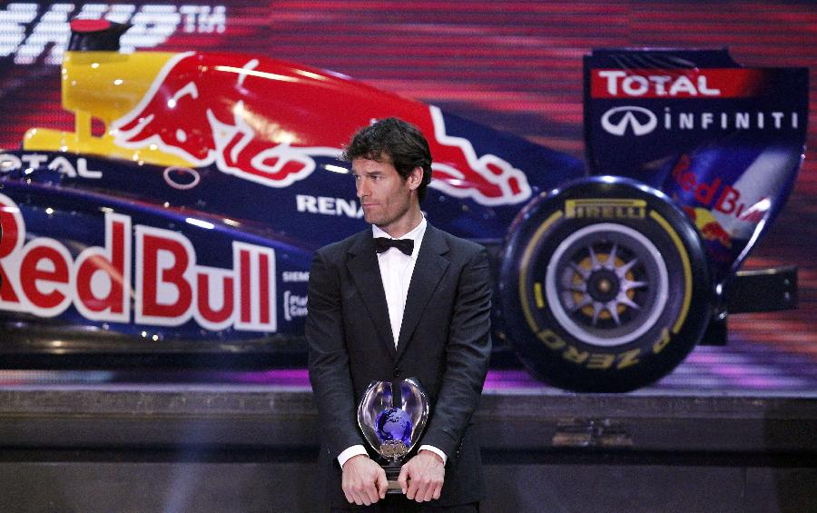 Mark Webber holds a trophy awarded at the annual FIA prize-giving gala in Delhi, Dec. 9, 2011. Mark Webber finished third in the standings. (Xinhua/Reuters Photo)