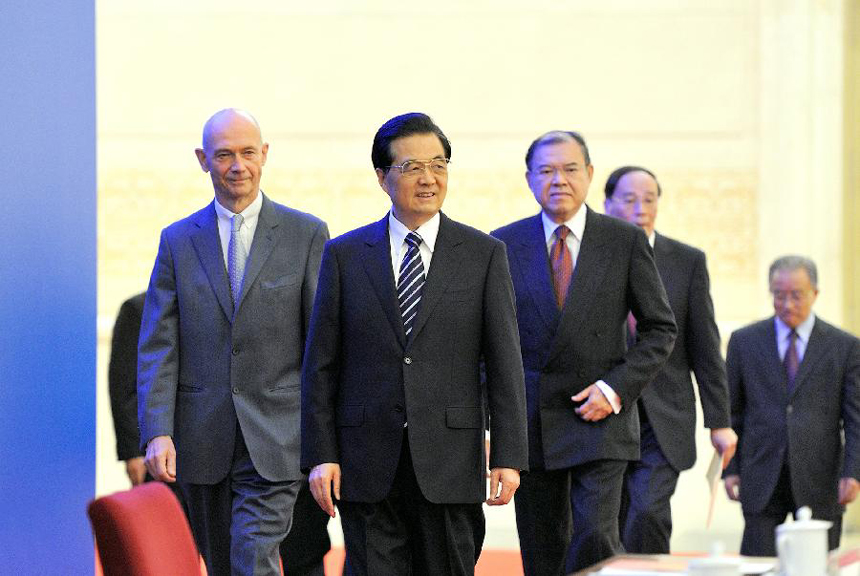 Chinese President Hu Jintao (2nd L), Director-General of the World Trade Organization (WTO) Pascal Lamy (1st L), Secretary-General of United Nations Conference on Trade and Development Supachai Panitchpakdi (3rd L) and Chinese Vice Premier Wang Qishan (4th L) arrive for the high level forum on the 10th anniversary of China's accession to the WTO in Beijing, capital of China, Dec. 11, 2011.