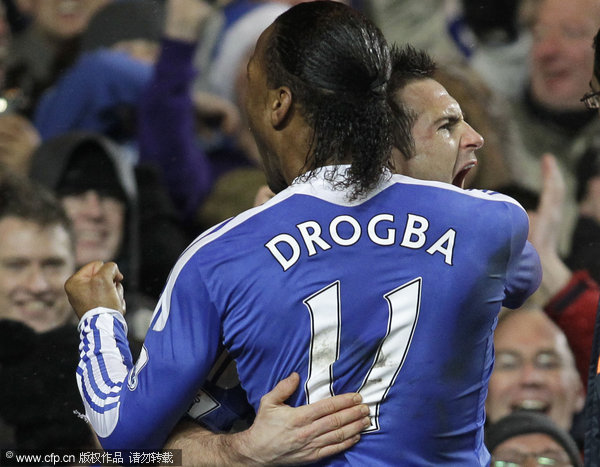 Chelsea's Frank Lampard (right) celebrates his penalty goal against Manchester City with teammate Didier Drogba during their English Premier League soccer match at Stamford Bridge on Monday, Dec. 12, 2011.