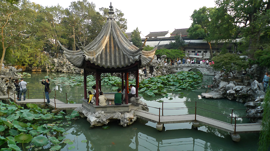 Located at the northeast of Suzhou, Jiangsu Province, the Lion Grove Garden is famous for the Taihu rocks in various shapes which are said to resemble lions, especially the large and labyrinthine grotto of rocks at the garden's center. It is recognized with other classical Suzhou gardens as a UNESCO World Heritage Site. [Photo by Xu Lin / China.org.cn]