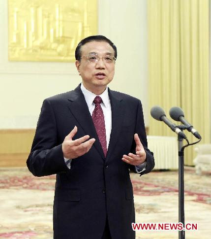 Chinese Vice Premier Li Keqiang speaks while meeting with participants of the ninth plenary meeting of the China-Russia Friendship Committee for Peace and Development (CRFCPD) in Beijing, capital of China, Dec. 12, 2011. (Xinhua/Ding Lin)