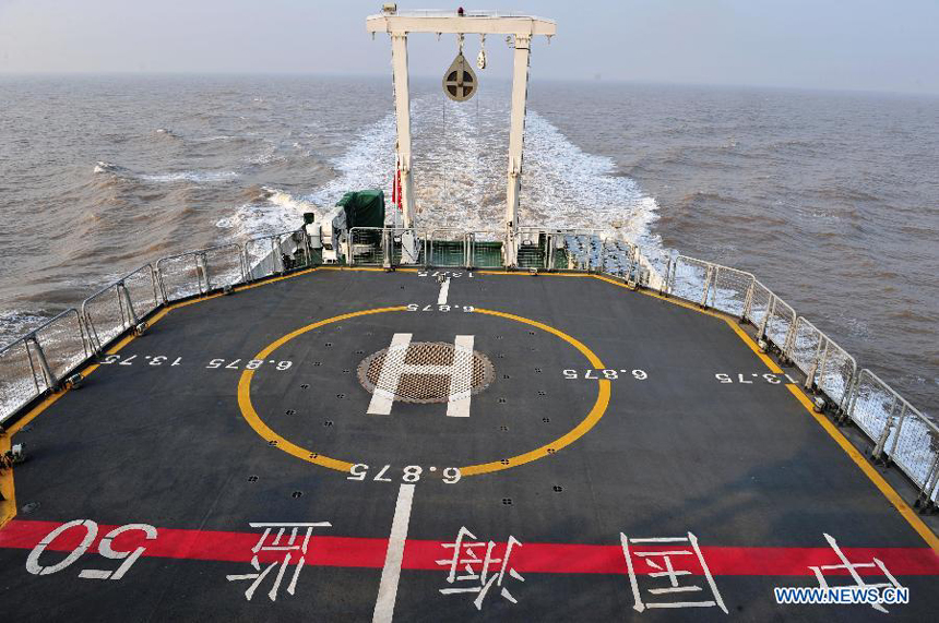 The 3,000-tonnage-class marine surveillance ship 'Haijian 50' sails on the Yangtze River near Shanghai, east China, Dec. 13, 2011. China on Tuesday sent its largest patrol ship 'Haijian 50' to the East China Sea for its maiden voyage