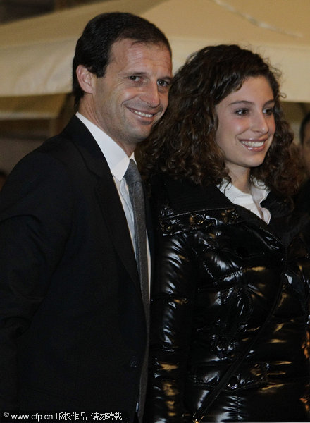 Milan coach Massimiliano Allegri flanked by his daughter arrive attend the AC Milan Christmas Party at the Royal Pavilion at the Central Station on December 14, 2011 in Milan, Italy.