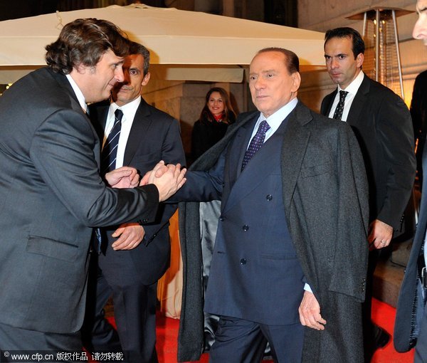 Silvio Berlusconi leaves after the AC Milan Christmas Party at the Royal Pavilion at the Central Station on December 14, 2011 in Milan, Italy. 