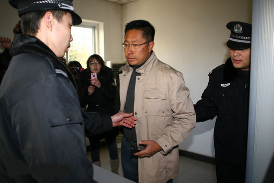 A Beijing court on Thursday heard divorce proceedings brought against China's famous 'Crazy English' teacher Li Yang for domestic abuse.