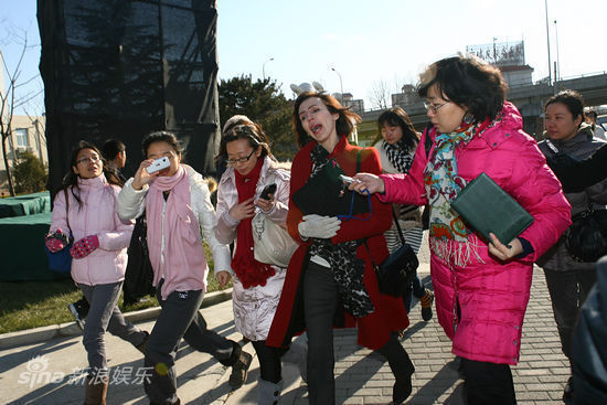 A Beijing court on Thursday heard divorce proceedings brought against China's famous 'Crazy English' teacher Li Yang for domestic abuse. In the picture, Li Yang's wife talks with reporters.