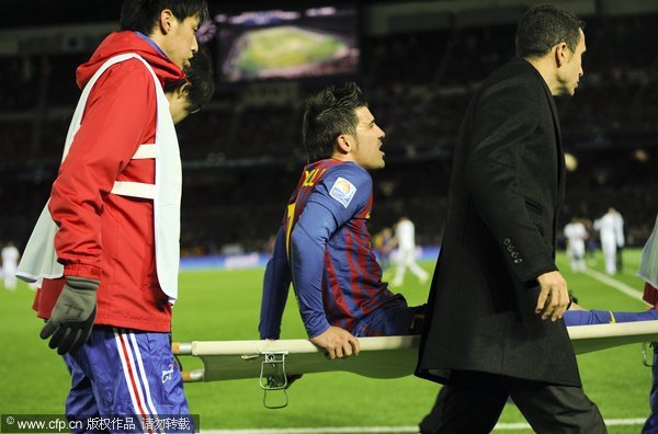 FC Barcelona David Villa is carried by a stretcher after injuring his leg during the first half of their FIFA Club World Cup semifinal match against Al-Sadd SC at Yokohama International Stadium in Yokohama, south of Tokyo, Japan on Dec.15, 2011.