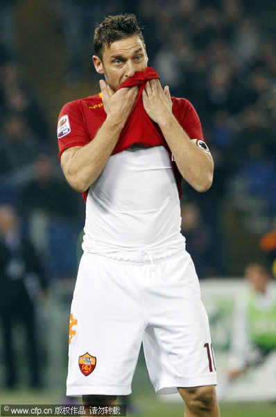 AS Roma's Francesco Totti reacts after he failed to score on a penalty kick during their Serie A soccer match between AS Roma and Juventus in Rome's Olympic stadium on Monday, Dec. 12, 2011.