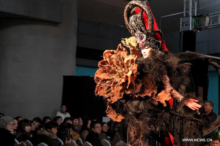 A model presents a creation made of chocolate during a chocolate fashion show at World Chocolate Wonderland in Shanghai, east China, Dec. 15, 2011. 