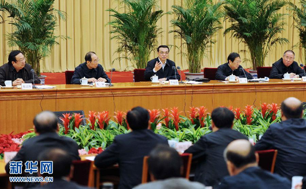 Chinese Vice Premier Li Keqiang (C back) speaks during a national symposium on development and reforms in Beijing, capital of China, Dec. 15, 2011. 