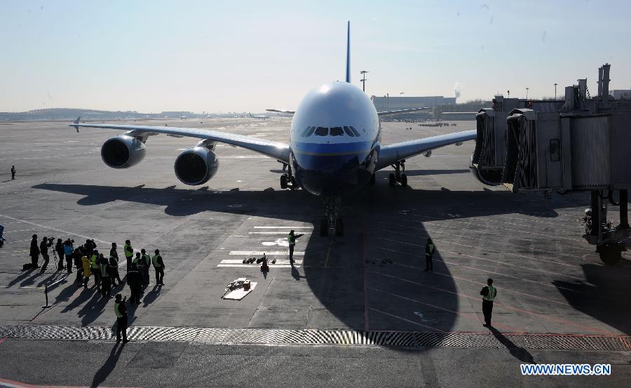 Photo taken on Dec. 18, 2011 shows an Airbus A380 landing at Capital International Airport in Beijing, capital of China. The second Airbus A380 ordered by China Southern Airlines arrived at the airport on Sunday after more than 10 hours' flight from France.