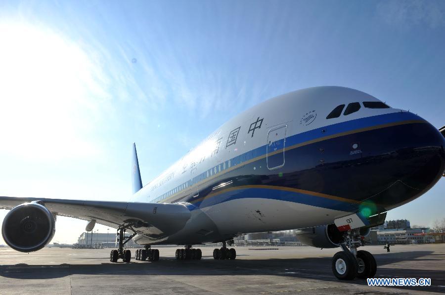 Photo taken on Dec. 18, 2011 shows an Airbus A380 landing at Capital International Airport in Beijing, capital of China. The second Airbus A380 ordered by China Southern Airlines arrived at the airport on Sunday after more than 10 hours' flight from France.