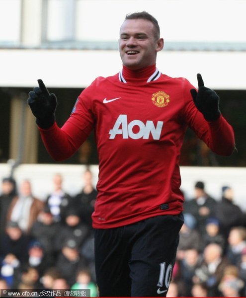 Wayne Rooney of Manchester United celebrates scoring their first goal during the Barclays Premier League match between Queens Park Rangers and Manchester United at Loftus Road on December 18, 2011 in London, England. 