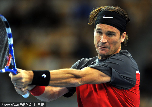  Carlos Moya played at 'Li Na and Friends' exhibition in Wuhan on Dec.18, 2011.