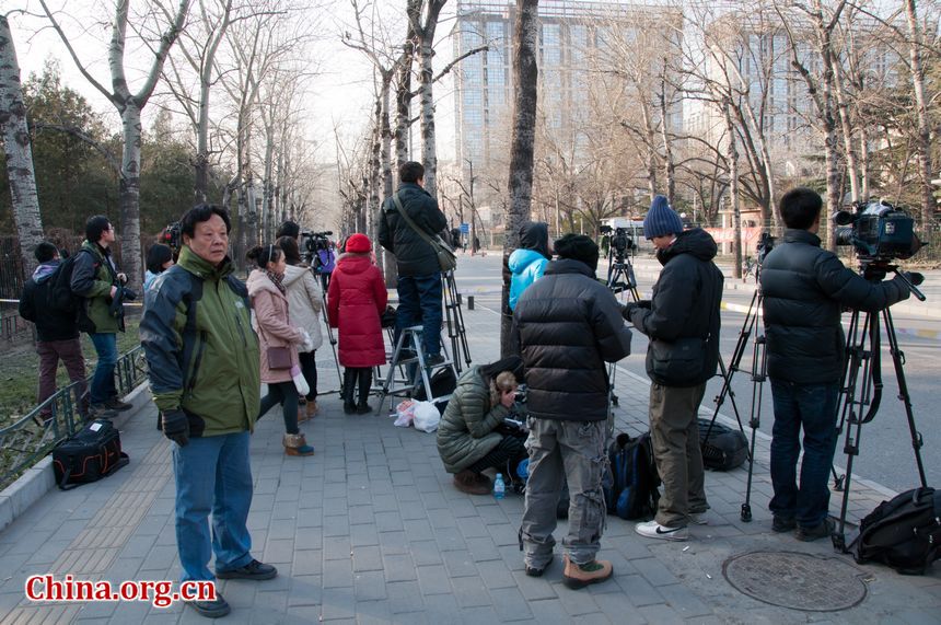 Police have cleared a special section for journalists outside the main gate of the DPRK's embassy in Beijing on Monday, December 19, 2011, amid the news that Kim Jong Il, DPRK's top leader has died. [Maverick Chen / China.org.cn]