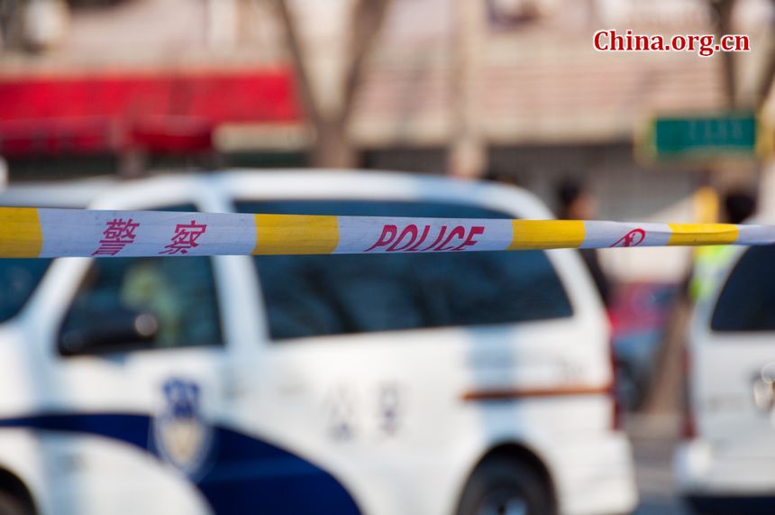 Police have cleared a special section for journalists outside the main gate of the DPRK's embassy in Beijing on Monday, December 19, 2011, amid the news that Kim Jong Il, DPRK's top leader has died. [Maverick Chen / China.org.cn]