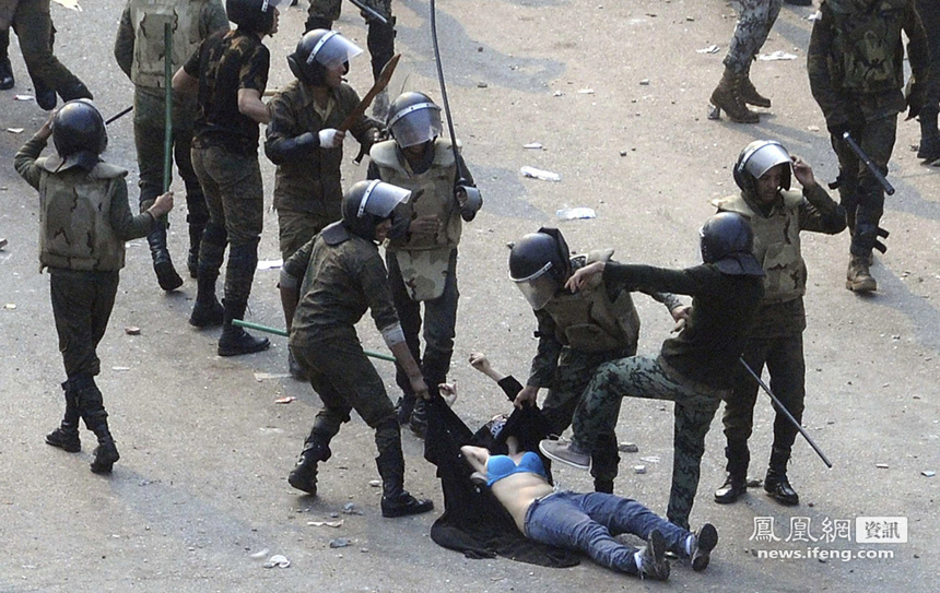 Photos and video posted on the web showed Egyptian troops pulling up the shirt of one woman protester in a conservative headscarf, leaving her half naked as they dragged her in the street on Saturday.