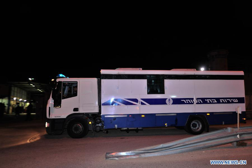 A vehicle of Israel Prison Services delivering Palestinians to be released arrives at the Ofer prison, on Dec. 18, 2011. Israeli authorities on Sunday night released 550 Palestinians in the second half of a prisoner swap with Hamas.