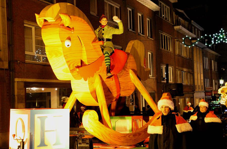 A rocking horse float takes part in the Christmas float parade held in Nivelles, Belgium, Dec. 17, 2011. About 14 floats offered performance and candies to local residents and tourists Saturday night at the Christmas float parade in Nivelles.