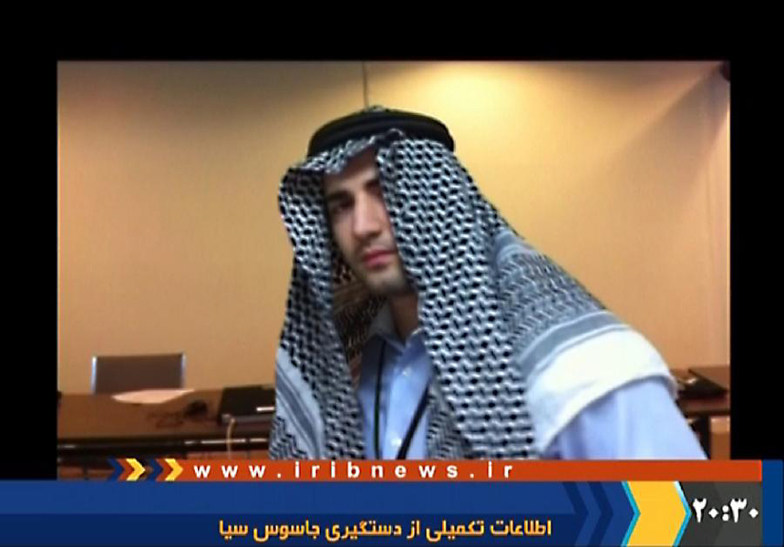A man, who identifies himself as Amir Mirzayi Hekmati and described as a CIA-spy by Iran's Intelligence Ministry, is seen speaking about his mission on Iranian state television in an unknown location in Iran, in this still frame taken from a video acquired December 18, 2011. 