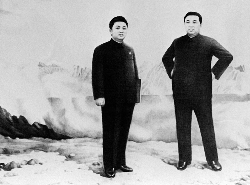 Kim Jong-il and his father. [File photo]