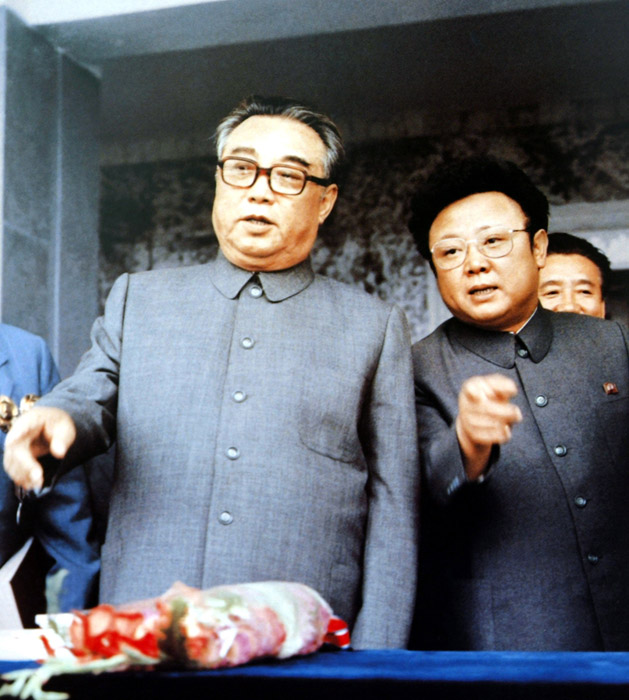 Kim Jong-il and his father. [File photo]