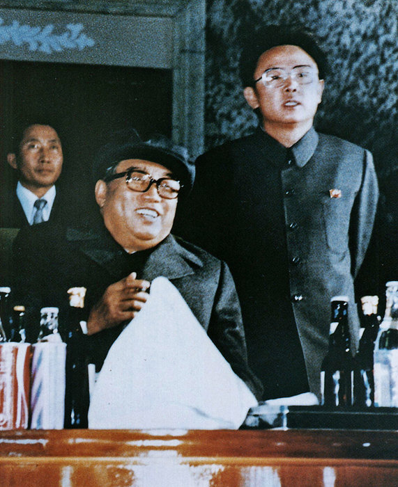 Kim Jong-il and his father. [File photo] 