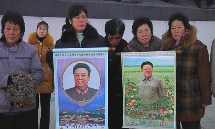 People of the Democratic People&apos;s Republic of Korea weep over the death of Kim Jong Il on Dec. 19, 2011. [Photo from sina.com.cn]