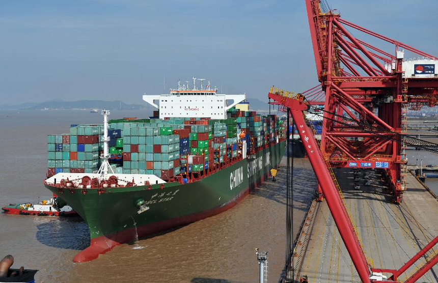 Photo taken on Aug. 10, 2011 shows a cargo vessel at the harbor of Ningbo, east China's Zhejiang Province.