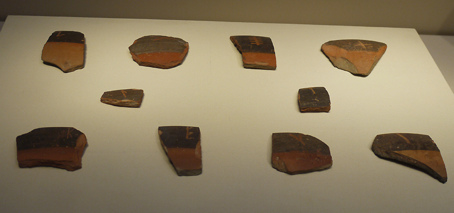 Pottery Shards with Engraved Symbol, Yangshao Culture (c. 5000-3000 BC), unearthed at Banpo, Xi'an, Shaanxi Province, 1955. It is exhibited in the section of Life and Production in Neolithic China, an exhibition of Ancient China in the National Museum of China.[Photo by Xu Lin / China.org.cn]