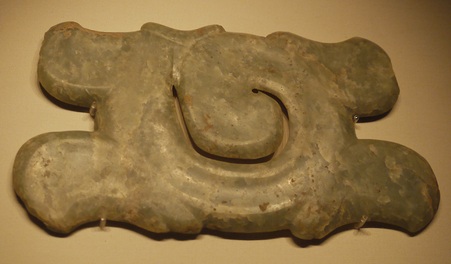 Hook-and-cloud Jade Ornament, Hongshan Culture (c. 4700-2900 BC), unearthed at niuheliang, Lingyuan, Liaoning Province, 1987. It is exhibited in the section of Life and Production in Neolithic China, an exhibition of Ancient China in the National Museum of China. [Photo by Xu Lin / China.org.cn] 