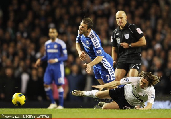 Luka Modric of Tottenham Hotspur competes against Branislav Ivanovic of Chelsea during the Barclays Premier League match between Tottenham Hotspur and Chelsea at White Hart Lane on December 22, 2011 in London, England.