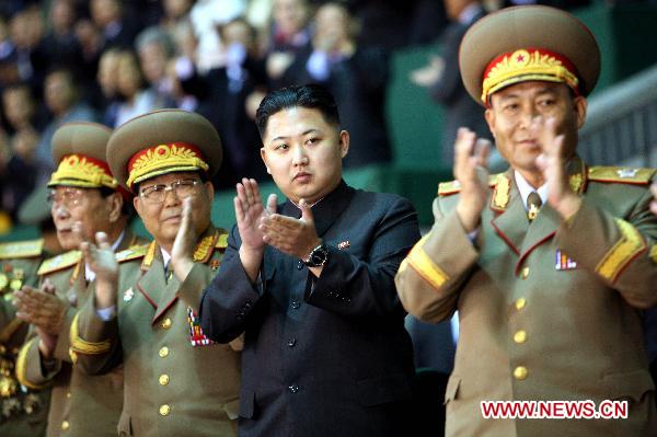 Kim Jong Un (2nd R), vice-chairman of the Central Military Commission of the Workers' Party of Korea (WPK), watches mass gymnastic and artistic performance 'Arirang' staged to celebrate the 65th anniversary of the founding of the WPK, in Pyongyang, capital of the Democratic People's Republic of Korea (DPRK), Oct. 9, 2010. [Xinhua file photo]