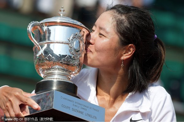 Li Na poses with her trophy after victory over Francesca Schiavone of Italy in the French Open final in Paris.