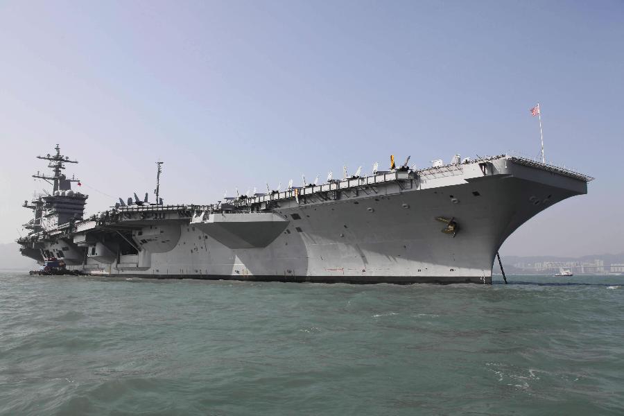 Photo taken on Dec. 27, 2011 shows the American aircraft carrier USS Carl Vinson in Hong Kong, south China, Dec. 27, 2011. The nuclear-powered supercarrier berthed in the water area of Hong Kong on Tuesday, starting a three-day visit for replenishment. [Jin Yi/Xinhua] 