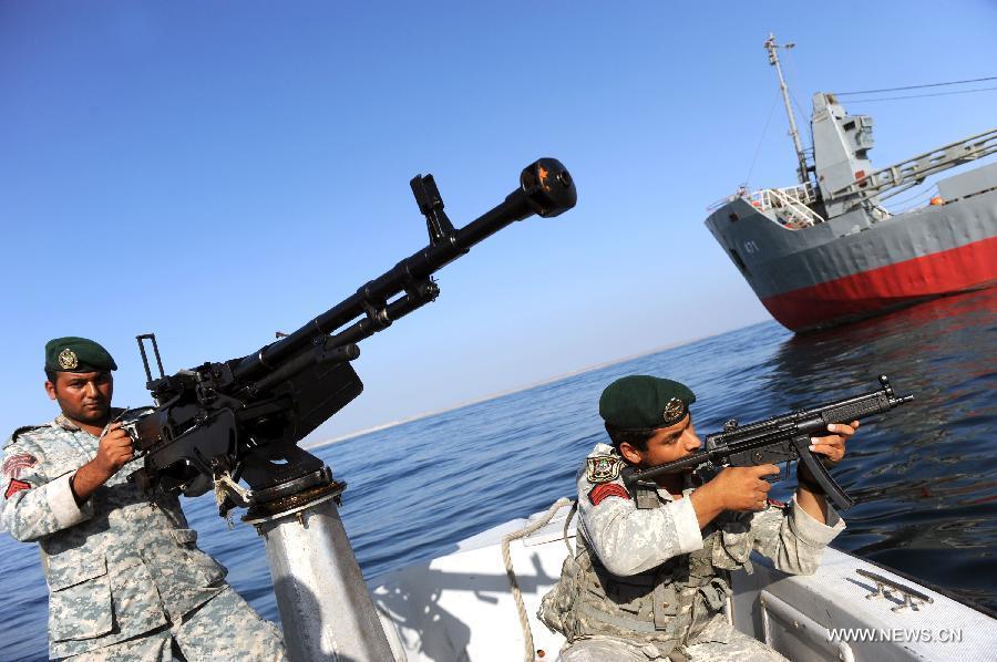Soldiers attend Iranian naval maneuvers dubbed Velayat 90 on the Sea of Oman, Iran, Dec. 28, 2011. The Iranian Navy launched 10-day massive naval exercises in the international waters on Saturday. The naval drills, dubbed Velayat 90, cover an area of 2,000 km stretching from the east of the Strait of Hormuz in the Persian Gulf to the Gulf of Aden. [Ali Mohammadi/Xinhua]