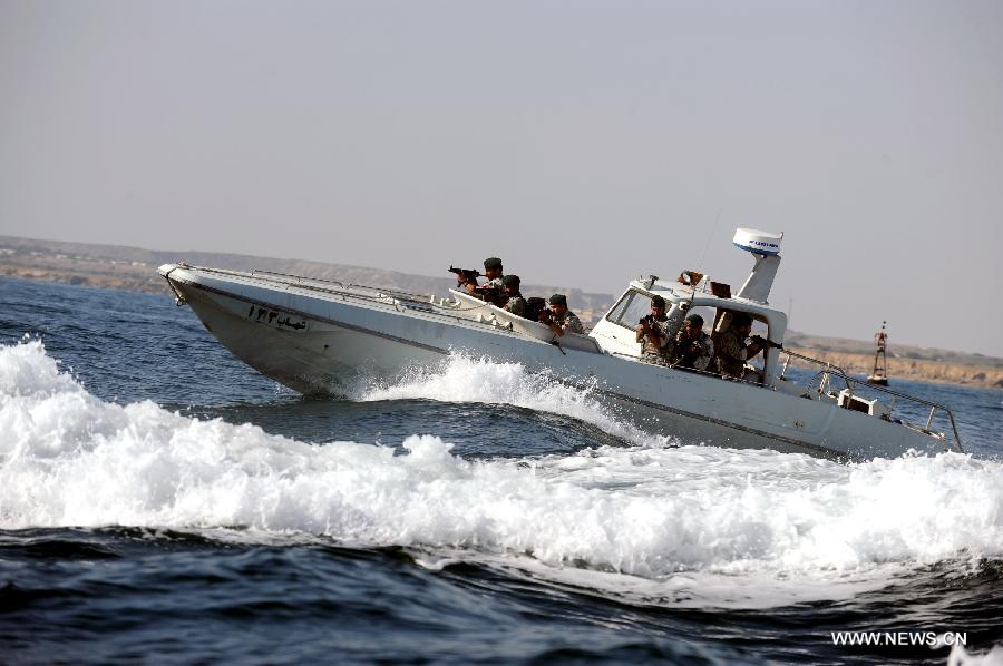 Soldiers are seen on a military speed boat during Iranian naval maneuvers dubbed Velayat 90 on the Sea of Oman, Iran, Dec. 28, 2011.[Ali Mohammadi/Xinhua]