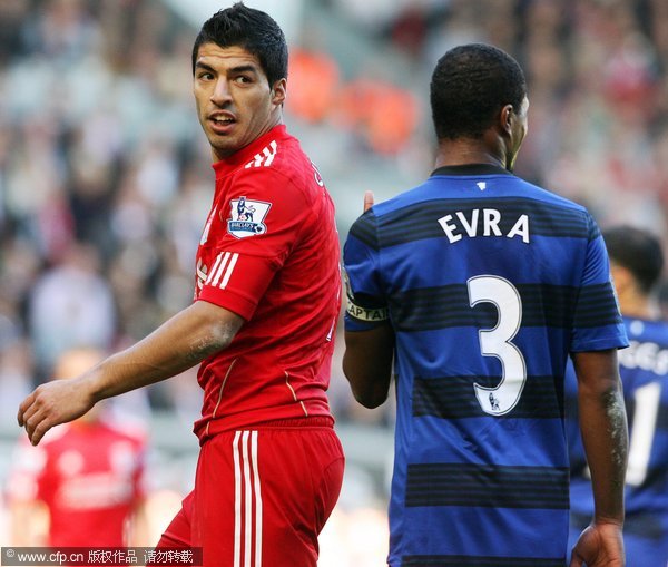 A file picture dated 15 October 2011 shows Liverpool's Luis Suarez (L) and Manchester United captain Patrice Evra (R) during an altercation in their English Premier League soccer match at Anfield in Liverpool, Britain. 