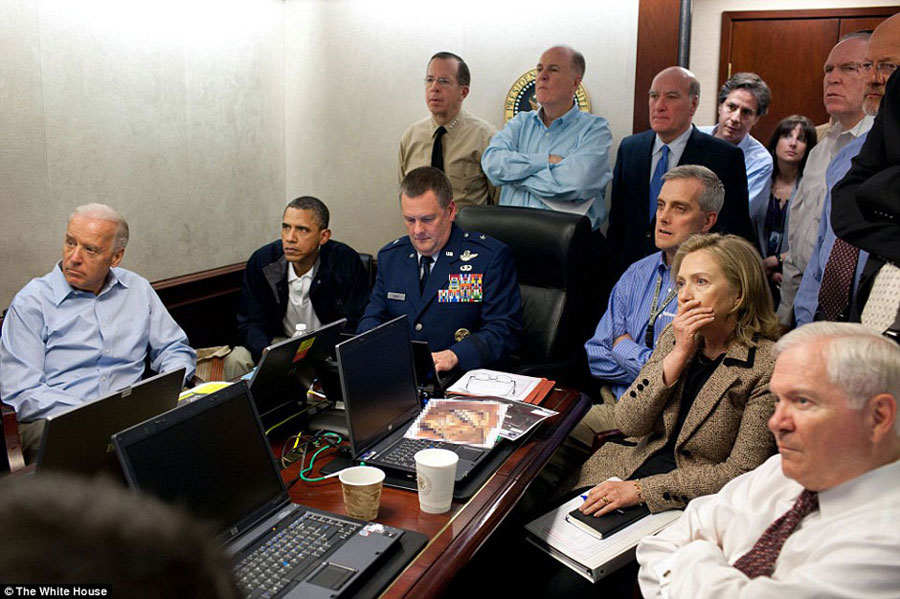 U. S. President Obama watches the mission to kill Osama bin Laden unfold at the White House on May 1, 2011 along with (left) Vice President Joe Biden, (right) Defence Secretary Robert Gates, and (second right) Secretary of State Hillary Clinton, alongside other Security staff, including (back left) Chairman of the Joint Chiefs Admiral Mike Mullen, (back without a tie) National Security Adviser Tom Donilon, and (back right, white shirt) Counter-Terrorism chief John Brennan. [White House]