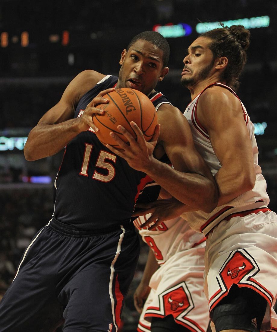 Al Horford of the Atlanta Hawks moves against Joakim Noah of the Chicago Bulls at the United Center on January 3, 2012 in Chicago, Illinois.