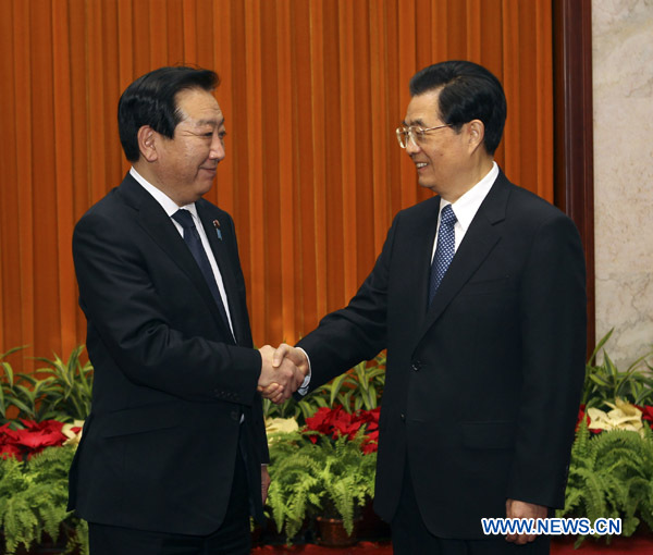 Chinese President Hu Jintao (R) meets with Japanese Prime Minister Yoshihiko Noda in Beijing, capital of China, Dec. 26, 2011. [Liu Weibing/Xinhua] 