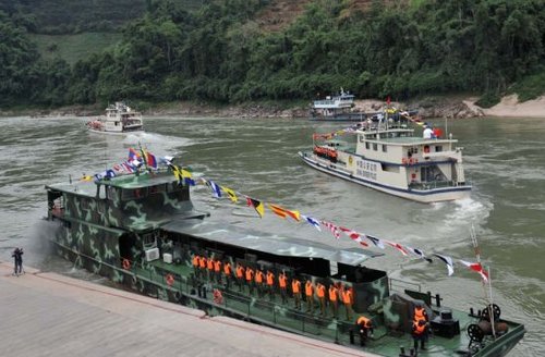 Police force from China, Laos, Myanmar and Thailand launches joint patrol along the Mekong River in Guanlei Port in Dai Autonomous Prefecture of Xishuangbanna, southwest China's Yunnan Province, Dec. 10, 2011. 