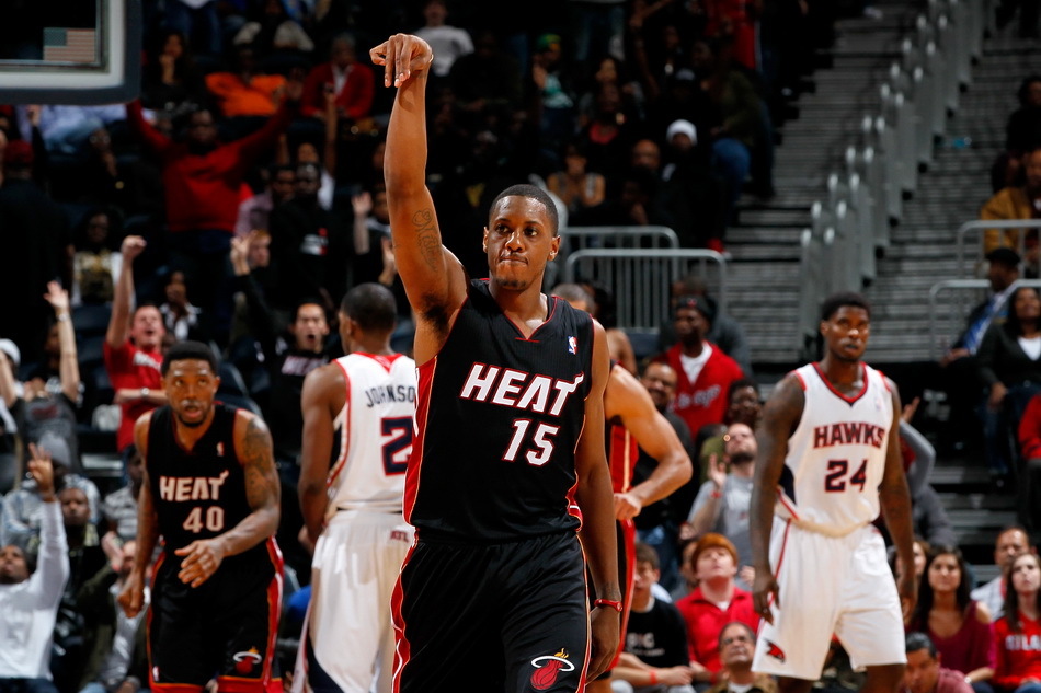 Mario Chalmers of the Miami Heat reacts after hitting a three-point basket in the third overtime against the Atlanta Hawks at Philips Arena on January 5, 2012 in Atlanta, Georgia.