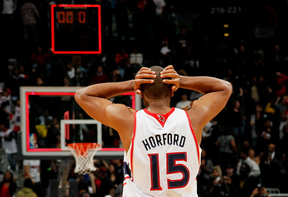 Al Horford of the Atlanta Hawks reacts after missing a basket at the end of the second overtime against the Miami Heat at Philips Arena on January 5, 2012 in Atlanta, Georgia.