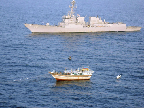 The guided-missile destroyer USS Kidd (DDG 100) responds to a distress call from the master of the Iranian-flagged fishing dhow Al Molai, who claimed he was being held captive by pirates in the Arabian Sea, in this handout photo taken January 5, 2012. [Photo/Agencies]